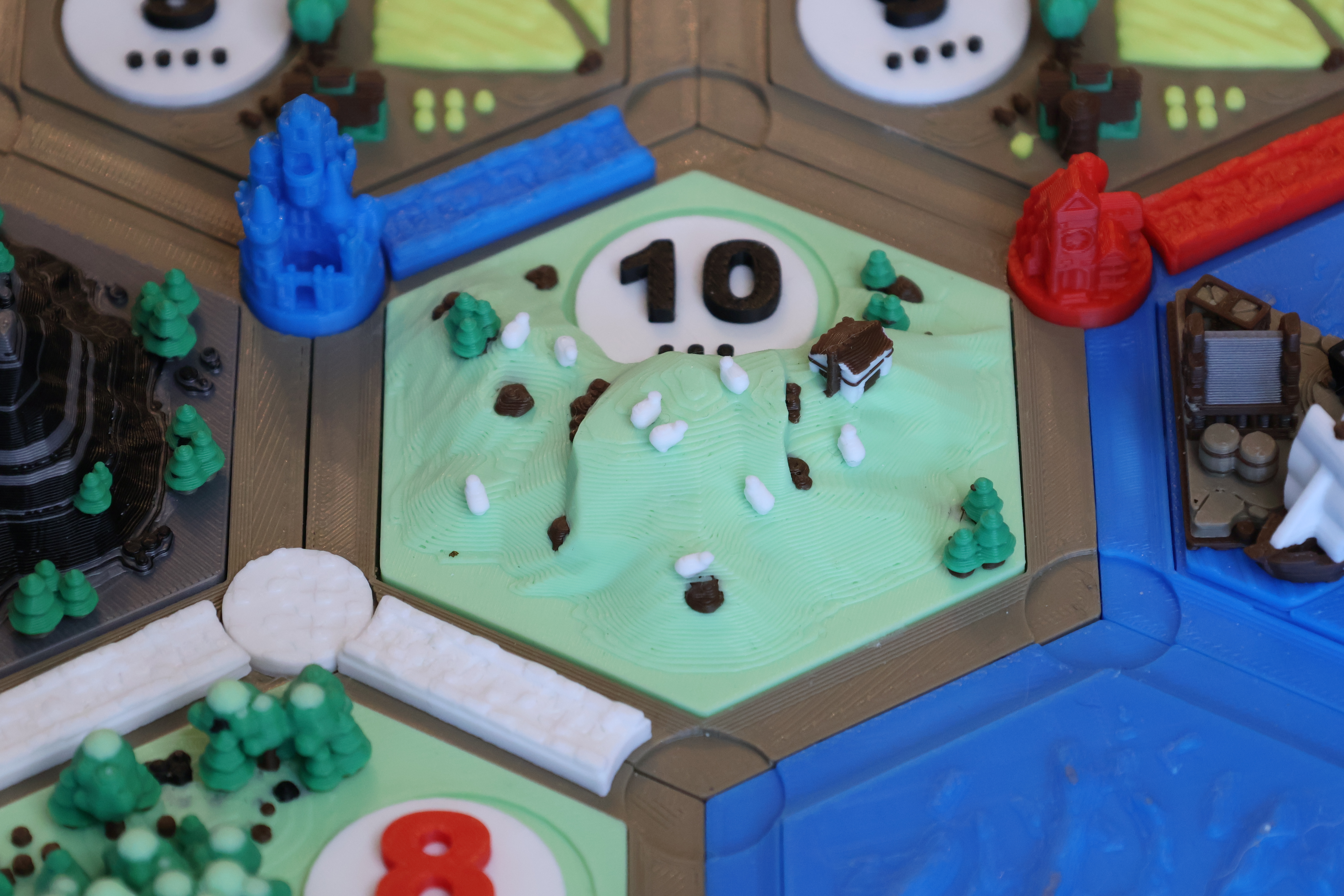 In-play detail of a pasture tile mid-game with player pieces in position