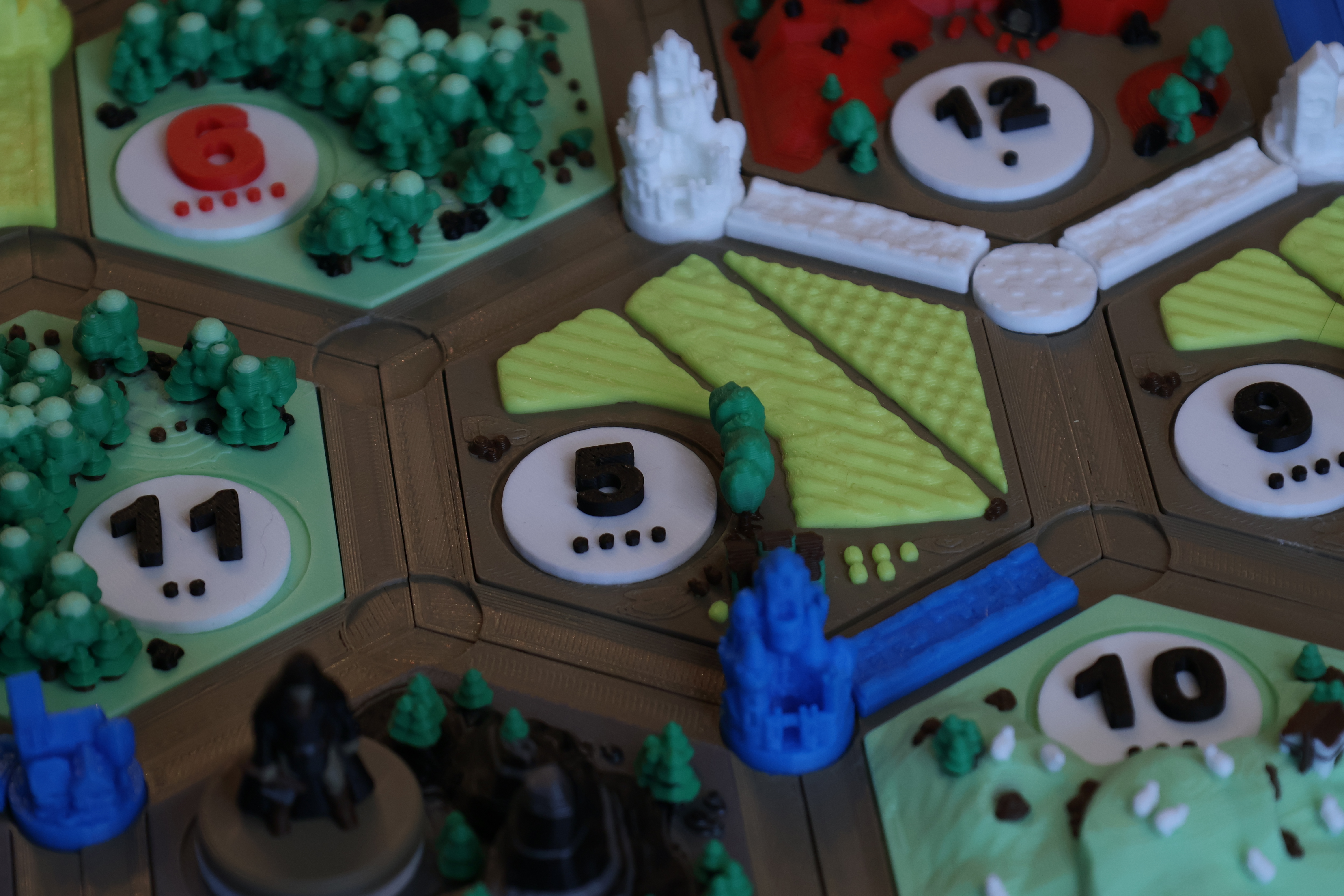 In-play detail of a wheat tile ringed by magnetic settlements and roads
